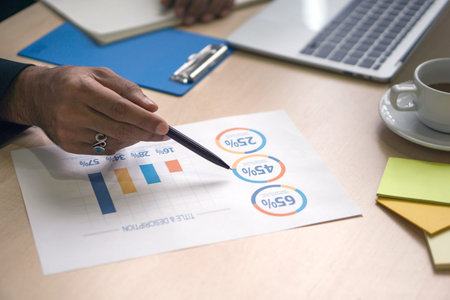 Closeup businessman in black suit with pen pointing at opportunity cost venture capital chart on...