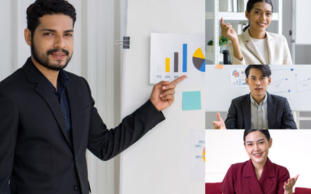 Head shot participants videoconference on-line meeting. Young wavy hair, moustache and beard businessman in black suit  pointing finger at pie chart on white board.の写真素材