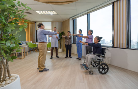 Asian retired men lead a group of elderly people to exercise. Morning atmosphere in a nursing home.
