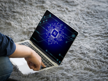 An individual engaged in work on a laptop, distinguished by a clearly visible AI cryptographic symbol.の写真素材