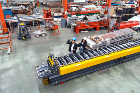 A high-tech automatic roll forming machine operates efficiently in a busy factory, transforming raw...