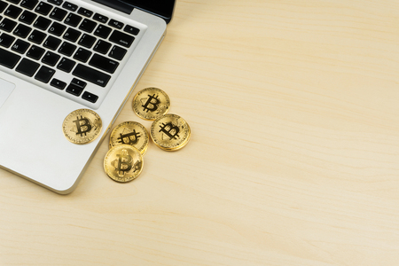 crypto currency mining concept, pile of bitcoins and a laptopの写真素材