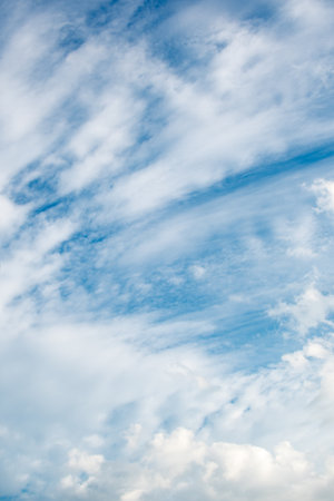 Blue sky with stratus and cumulus cloudsの写真素材