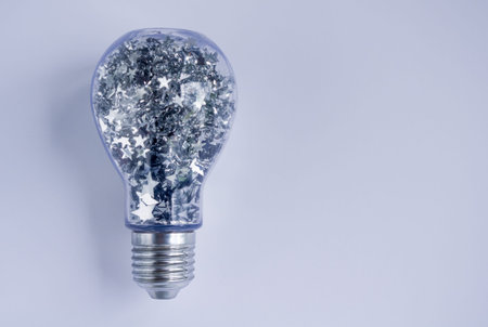 Lightbulb Filled with Shiny Silver Stars