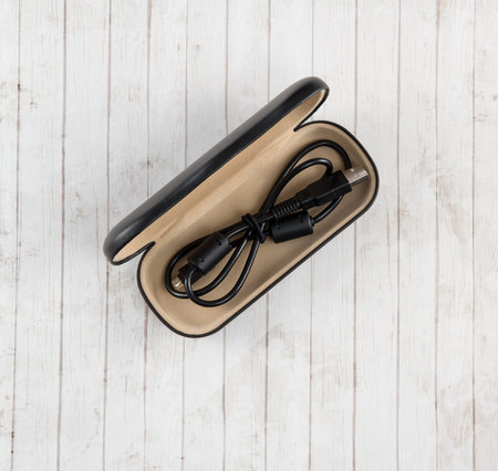 Cord Caddy on White Plank Background