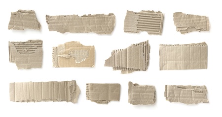 Pieces of torn brown corrugated cardboard, Isolated on White の写真素材