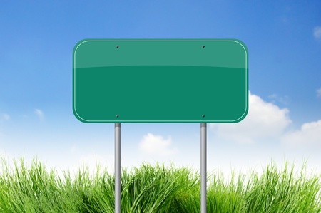 Blank Green Road Sign on skyの写真素材