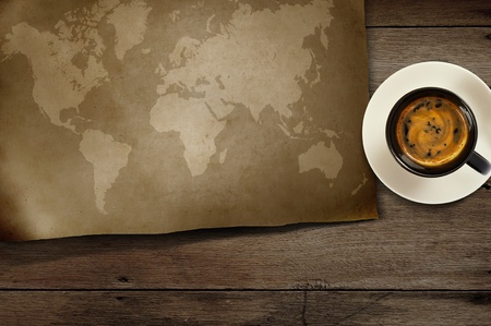 vintage world map and coffee on woodenの写真素材