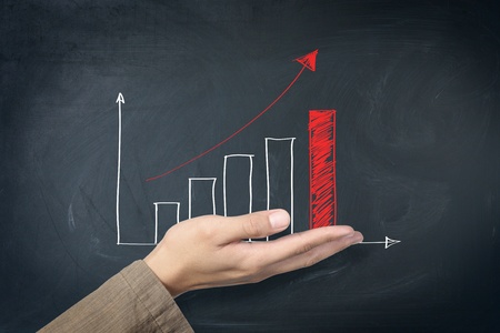 red arrow graph on handの写真素材