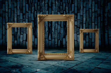 Three blank, white frames on a brick wall. 