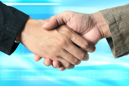 Closeup of business people shaking hands 