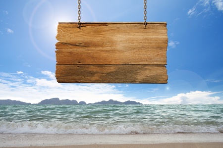 wood sign hanging on beachの写真素材