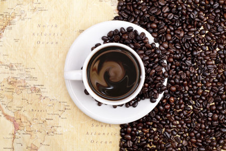coffee beans on world map background