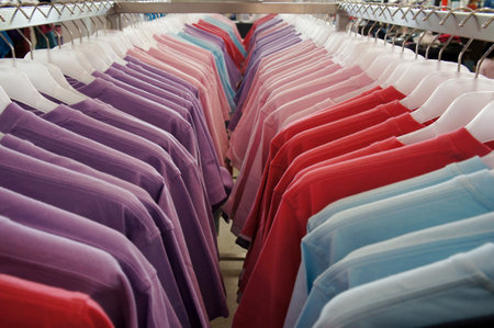 Colorful t-shirts on the hanger 