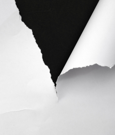 ripped paper on dark background の写真素材