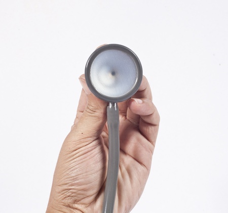 Female hand with stethoscope on white.
の写真素材