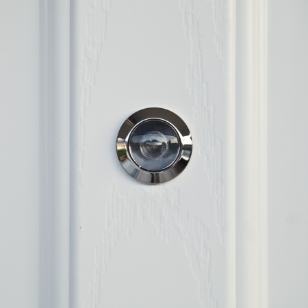 close up, door lens peephole on white wooden texture の写真素材