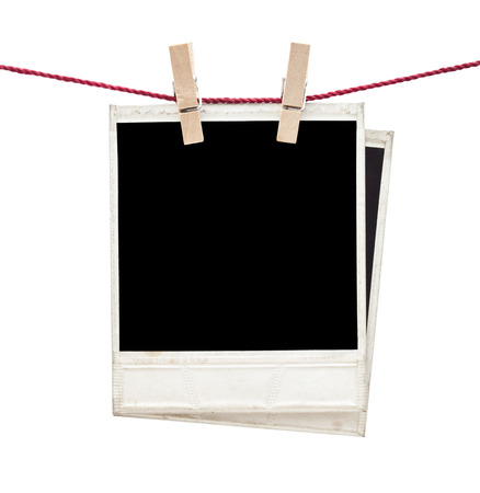 two polaroid photos  hanging isolatedの写真素材