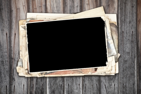 close-up old photos on wooden wallの写真素材