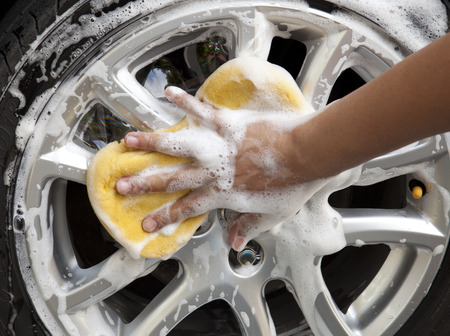 car wash with yellow sponge の写真素材