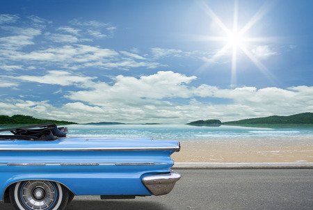 Classic blue cabriolet on a beach at blue sky.のeditorial素材