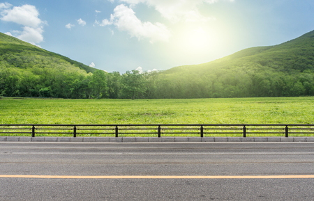 Side View on Country Road whit mountain.の写真素材