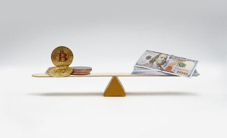 crypto dollar balancing on white background.の写真素材