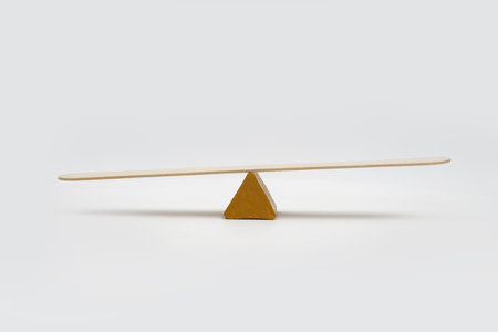Empty seesaw unbalance on white background.の写真素材