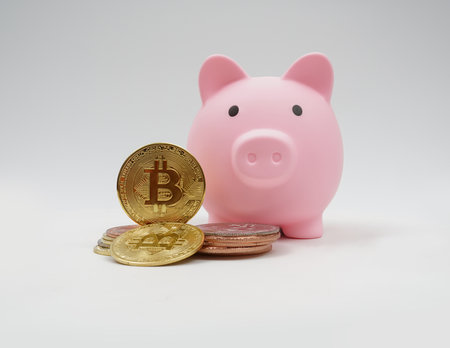 Piggy bank saving, crypto on white background.の写真素材
