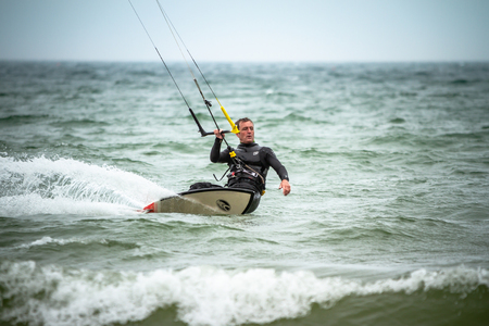 kitesurfer one handed surfingの写真素材