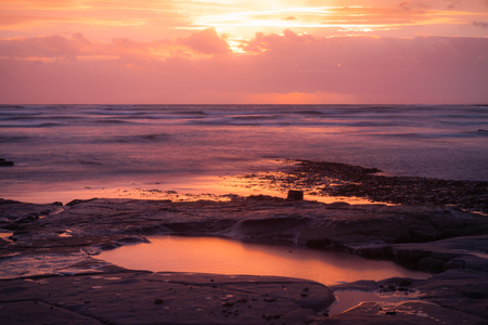 Reflection pool at Kimmeridge Bayの写真素材