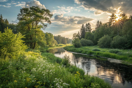 Serene sunset over a tranquil river flowing through lush greenery and wildflowers.の素材