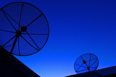 Satellite dish in blue sky