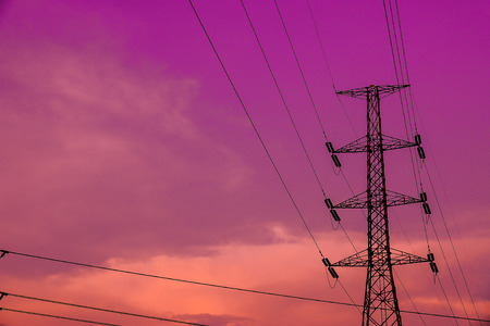 Electricity pylons on sunsetの写真素材