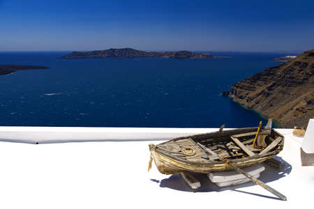 A boat on the roof of a restaurant in Thiraの写真素材