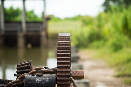 Close up rusty and oily watergate gear.の写真素材