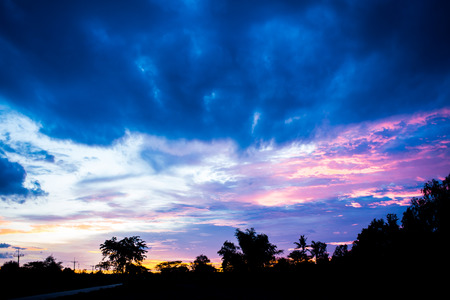 Silhouette of dramatic sunset and sunrise skyの写真素材