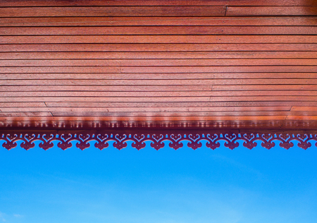 stencil wood eaves on blue skyの写真素材