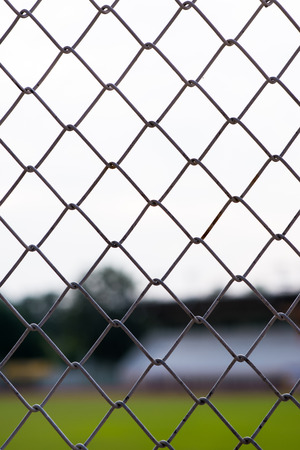 metal fences with blur stadium backgroundの写真素材