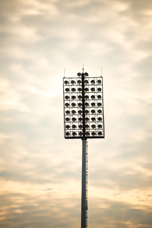 Close up of stadium lights in warm toneの写真素材