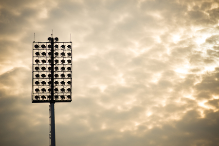 Close up of stadium lights in warm toneの写真素材
