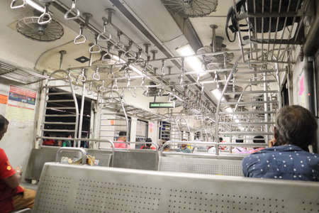 Unidentified people inside of a subway train.の写真素材