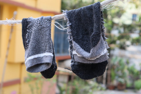 Woolen socks drying on a clothesline.