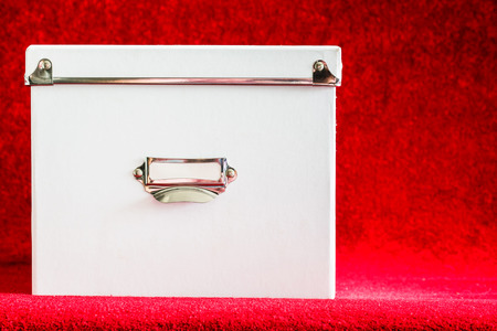 White box over on a red backgroundの写真素材