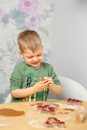 Red gingerbread shapes, gingerbread dough, dough roll.の写真素材