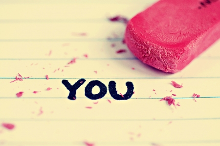 Eraser and eraser peices on paper with the word you in permanent markerの写真素材
