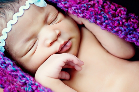 Sleeping Newborn Baby Girl In Purple Cocoon Podの写真素材