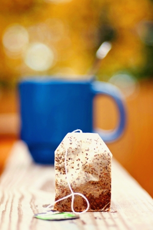 Tea Bag With Mug In Backgroundの写真素材