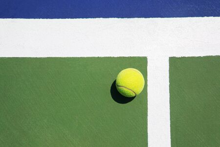 Tennis ball on colorful groundの写真素材