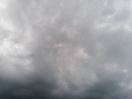 Gray storm clouds gathering before the rain startsの写真素材